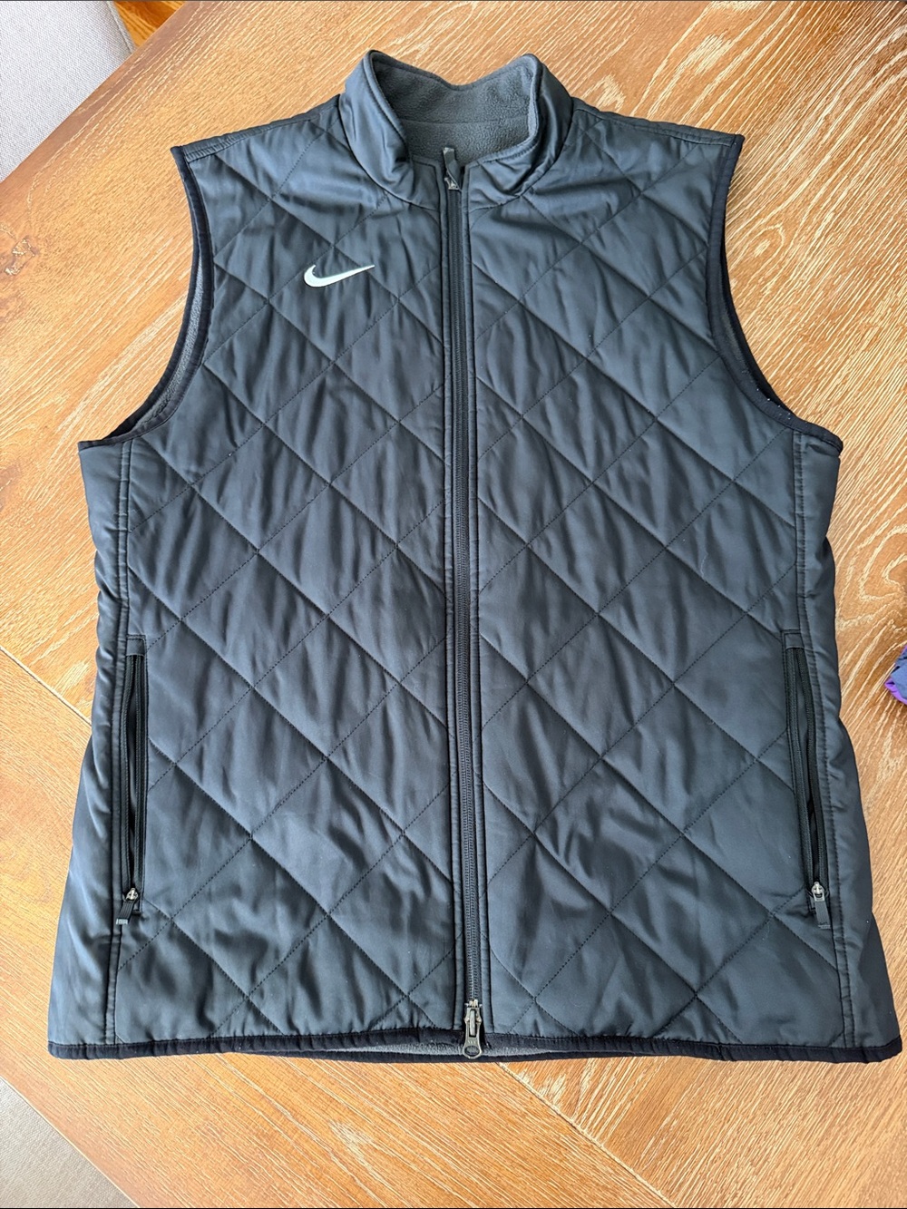 Nike Men’s Black Quilted Sleeveless Vest with White Swoosh
